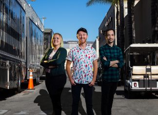 For The Win: Turning Heroes Into Heroes Tech alumns Jesse Wilson, Megan Pearson and Jaimie Trublood behind the scenes of a movie set standing proudly