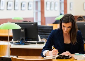 Reflections on Study Abroad: Isabel Thoma Isabel is seen annotating a text book at a table