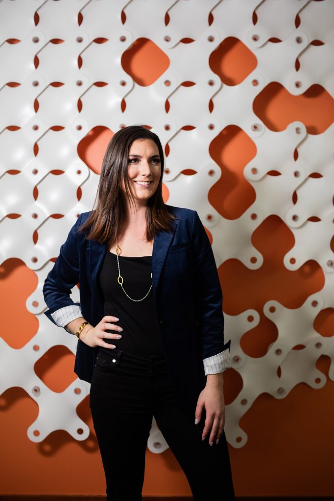 An orange patterned backdrop compliments the crushed blue velvet of Isabel’s jacket An orange patterned backdrop compliments the crushed blue velvet of Isabel's jacket