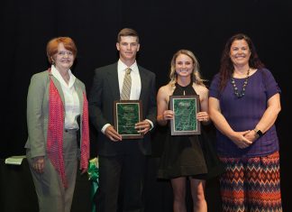 Henson, McDearmon Earn Falls and Tucker Awards Dr. Bowen stands with the Tucker and Falls award winners