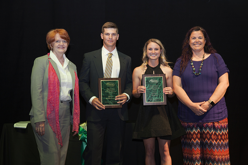 Dr. Bowen stands with the Tucker and Falls award winners