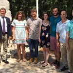 Study Abroad Group to Share Experiences from France Students pose for a photograph next to a WWII monument