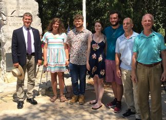 Arkansas Tech Students Experiencing French Culture Students pose for a photograph next to a WWII monument