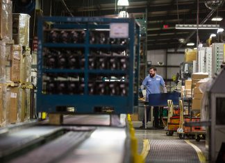 The Business of Logistics An ATU Ozark student is seen operating a piece of machinery