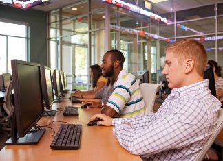 Then & Now – Fall 2018 Students work in a high-tech computer lab found in Rothwell