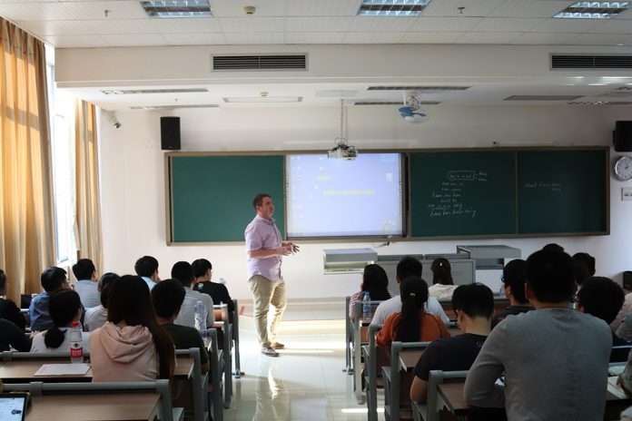 Tech alumnus Matt Parker lectures about Chinese Calligraphy while using a smartboard and projector Tech alumnus Matt Parker lectures about Chinese Calligraphy while using a smartboard and projector