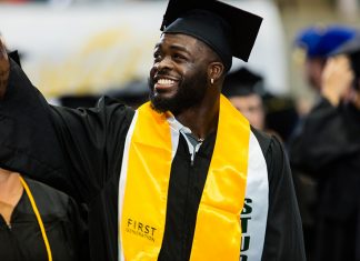 Many Paths, One Achievement: Summer Graduation Cua’ Rose waves to his family at the graduation ceremony